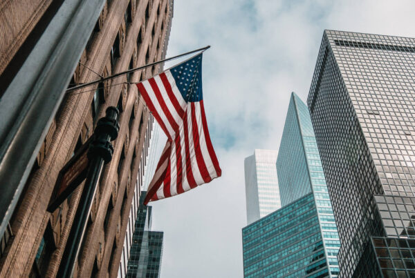 American flag and skyscrapers.